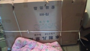 the delivered crib with mattress, pre-assembly
